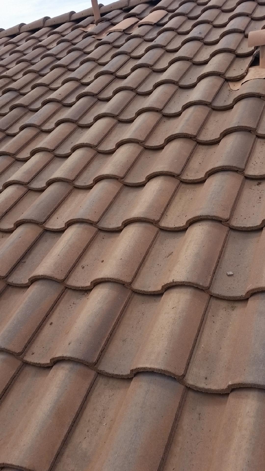 Showing completed tile roof repair.